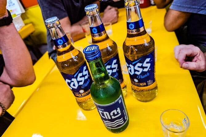 Busan: Food Crawl with Fish Market, Soju Tents & Local Snacks - Reading Jagalchi Fish Market with a guide