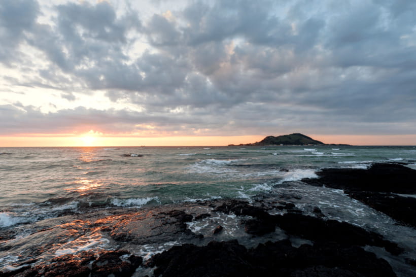 Jeju: Sunset Tour Olle Trail Walking Tour with Hotel Pickup - The drive west from Jeju City