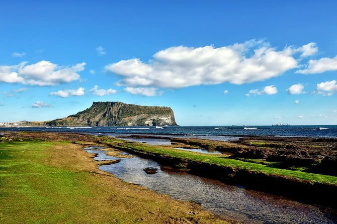 Jeju Unesco Eest course Package Private Van Guided Tour - Framing Seongsan Ilchulbong from Gwangchigi Beach