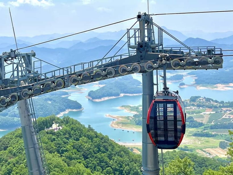 Seoul: Chungju Cruise, Cable Car & Cave Kayak Adventure Tour - Chungju Lake, cliffs and a 20-minute boat ride