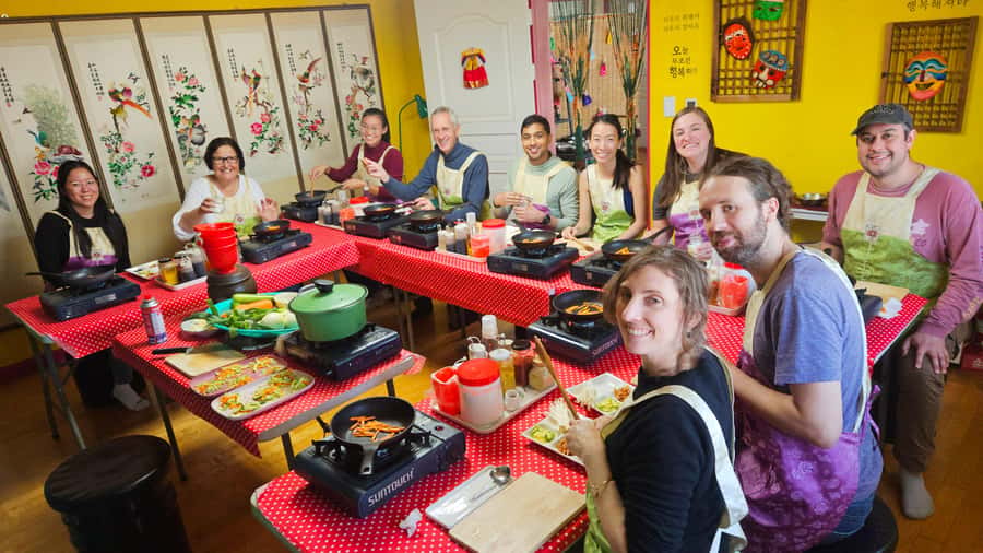 Seoul: Korean Cooking Class at a Local Home and Market Tour - Cooking bibimbap, dakgalbi, haemul-pajeon, and doenjang-jjigae