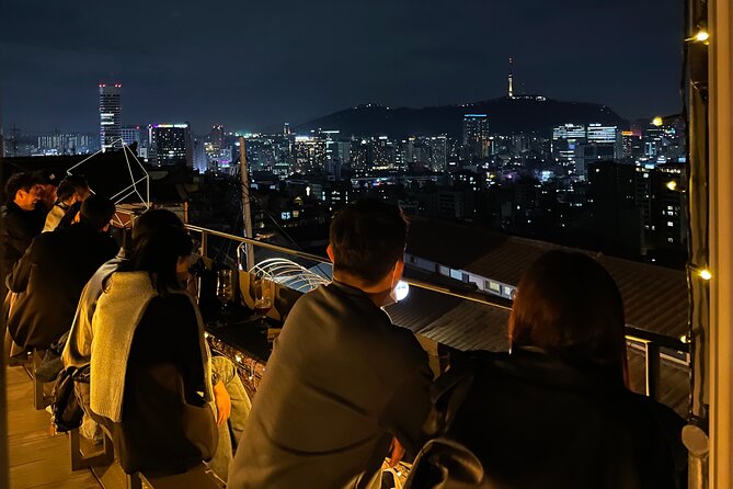 Sunset Walking Tour in Naksan Park with Dinner - A drink on a hillside café terrace